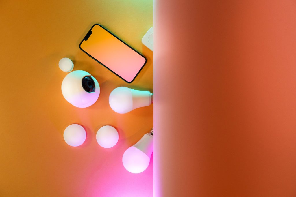 Top view of smart light bulbs and a smartphone