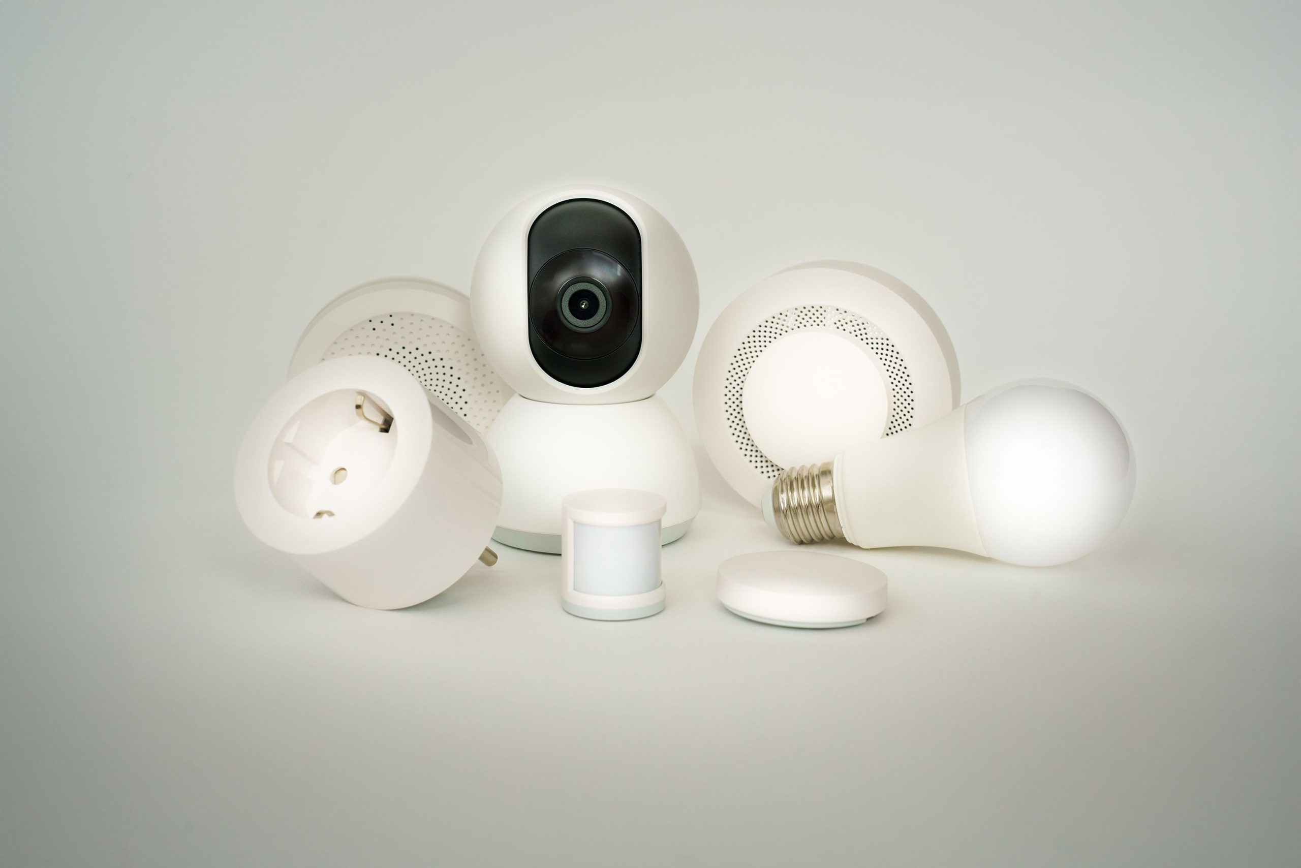 Collection of smart home devices including bulbs, sockets, and cameras