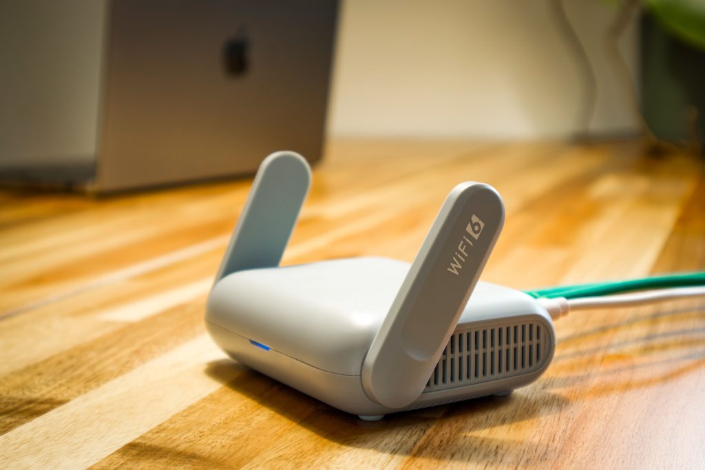 Modern WiFi 6 router on a wooden desk