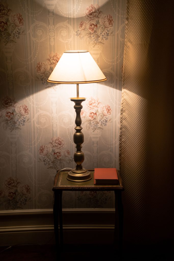 Warm glowing table lamp in a cozy room